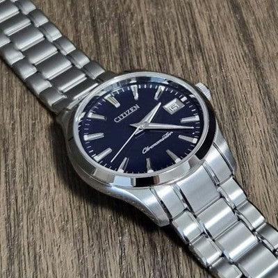 CITIZEN THE CITIZEN CTQ57-0062 QUARTZ ANNUAL ACCURACY PERPETUAL CALENDAR WATCH