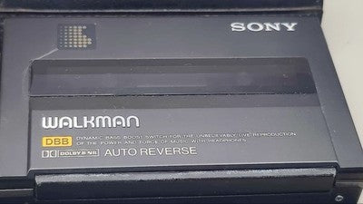 SONY WM-150 CASSETTE WALKMAN PORTABLE PLAYER WITH COVER FOR PARTS OR NOT WORKING