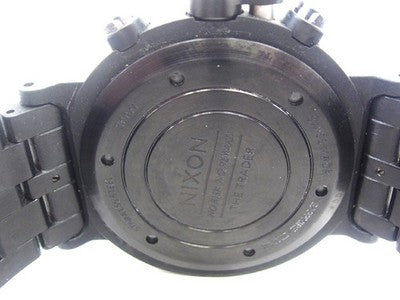 NIXON A153-001 TRADER QUARTZ WATCH 45MM BLACK DIAL - SCRATCHES ON BEZEL, DIRT
