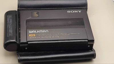 SONY WM-150 CASSETTE WALKMAN PORTABLE PLAYER WITH COVER FOR PARTS OR NOT WORKING