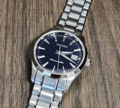 CITIZEN THE CITIZEN CTQ57-0062 QUARTZ ANNUAL ACCURACY PERPETUAL CALENDAR WATCH
