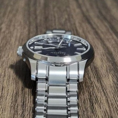 CITIZEN THE CITIZEN CTQ57-0062 QUARTZ ANNUAL ACCURACY PERPETUAL CALENDAR WATCH