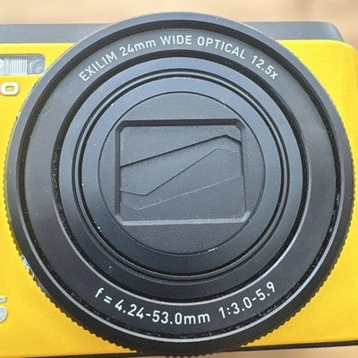 CASIO EXILIM EX-ZR1100 16.1MP YELLOW DIGITAL CAMERA W/BATTERY,CHARGER