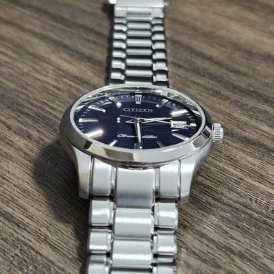CITIZEN THE CITIZEN CTQ57-0062 QUARTZ ANNUAL ACCURACY PERPETUAL CALENDAR WATCH