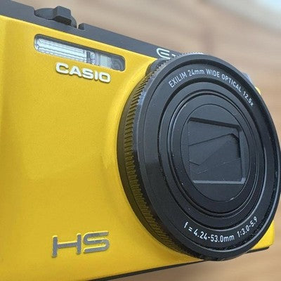 CASIO EXILIM EX-ZR1100 16.1MP YELLOW DIGITAL CAMERA W/BATTERY,CHARGER